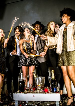 Multi-ethnic group of friends celebrating in a nightclub - Clubbers having party